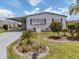 Inviting single-story home with a covered carport, mailbox, and beautiful landscaping at 798 Fairmount Dr, North Port, FL 34287