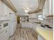 Kitchen offering modern appliances and adjacent to the dining area and living room at 798 Fairmount Dr, North Port, FL 34287