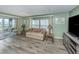 Inviting living room featuring modern wood-look floors and comfortable furniture at 798 Fairmount Dr, North Port, FL 34287