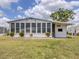 Home features a Florida room with lots of light, adjacent to the open backyard at 798 Fairmount Dr, North Port, FL 34287