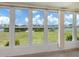 Waterfront views from a sunroom full of large windows and lots of natural light at 798 Fairmount Dr, North Port, FL 34287