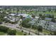 Aerial view of the clubhouse, pool, tennis courts, and golf course in the community at 819 Montrose Dr # 102, Venice, FL 34293