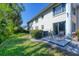Townhouse with a cozy patio overlooking a lush backyard with mature landscaping at 819 Montrose Dr # 102, Venice, FL 34293