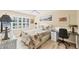 Bright bedroom features a large window, ceiling fan, and a small desk at 819 Montrose Dr # 102, Venice, FL 34293