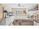Bright bedroom features a large window and ceiling fan at 819 Montrose Dr # 102, Venice, FL 34293