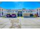 Inviting condo complex with covered parking, lush landscaping, and a well-maintained exterior in a convenient location at 819 Montrose Dr # 102, Venice, FL 34293