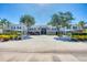 Well-maintained condo complex with mature trees providing shade and a welcoming atmosphere for residents and guests at 819 Montrose Dr # 102, Venice, FL 34293