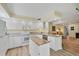 Well-lit kitchen with granite counters and an island at 819 Montrose Dr # 102, Venice, FL 34293