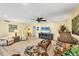 Inviting living room featuring a beach theme, hardwood floors, and comfortable seating for a relaxing retreat at 819 Montrose Dr # 102, Venice, FL 34293