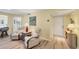 Bright living room features hardwood floors, comfortable seating, and a welcoming atmosphere, perfect for relaxation at 819 Montrose Dr # 102, Venice, FL 34293