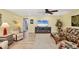 Bright and airy living room featuring hardwood floors, comfortable seating, and a coastal-inspired design at 819 Montrose Dr # 102, Venice, FL 34293