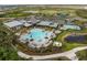 Resort-style community featuring a clubhouse, pool, and recreation areas, surrounded by greenery at 8304 Shooting Star Rd, Sarasota, FL 34241