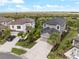 An aerial view of this home, it shows the lush landscaping, well-manicured lawn, and neutral color palette at 8304 Shooting Star Rd, Sarasota, FL 34241