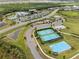 Active community featuring tennis courts, a basketball court, clubhouse, pool, and scenic ponds at 8304 Shooting Star Rd, Sarasota, FL 34241