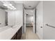 Bathroom featuring a vanity with a sink, tile floors, and a view into the bedroom at 8304 Shooting Star Rd, Sarasota, FL 34241