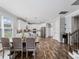 Well-lit dining area with modern decor, seamlessly connecting to the kitchen, perfect for Gathering meals and gatherings at 8304 Shooting Star Rd, Sarasota, FL 34241