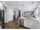 Well-designed kitchen showcasing a center island, stainless steel appliances, and an open view into the living area at 8304 Shooting Star Rd, Sarasota, FL 34241