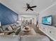 Open-concept living space featuring modern decor, comfortable seating, and seamless access to the dining area and kitchen at 8304 Shooting Star Rd, Sarasota, FL 34241