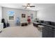 Spacious upstairs living room features a couch and two windows at 8304 Shooting Star Rd, Sarasota, FL 34241