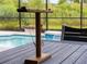 Backyard pool featuring an outdoor ring toss game, a privacy fence, and lush greenery at 8304 Shooting Star Rd, Sarasota, FL 34241