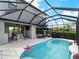 Beautiful pool and outdoor seating are enhanced by the screened-in enclosure at 8304 Shooting Star Rd, Sarasota, FL 34241