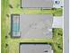 Aerial view of home and lot with screened in lanai and pool with view of the neighborhood at 8529 Saint Kitts Cir, Englewood, FL 34224