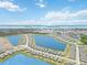 Wonderful aerial view of the community, showcasing the lakes, landscaping, and nearby location at 8529 Saint Kitts Cir, Englewood, FL 34224