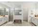 Modern bathroom features double vanities and dual walk-in showers for a luxurious experience at 8529 Saint Kitts Cir, Englewood, FL 34224