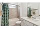 Bathroom with shower-tub combination and modern vanity sink at 8529 Saint Kitts Cir, Englewood, FL 34224