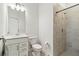 Bathroom featuring walk-in shower with tiled surround at 8529 Saint Kitts Cir, Englewood, FL 34224