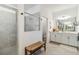 Bright bathroom features a walk-in shower, double vanity, and modern finishes at 8529 Saint Kitts Cir, Englewood, FL 34224