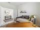 Cozy bedroom featuring a daybed, warm lighting, and stylish decor for a comfortable retreat at 8529 Saint Kitts Cir, Englewood, FL 34224