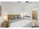 Bedroom with neutral decor and attached bathroom at 8529 Saint Kitts Cir, Englewood, FL 34224