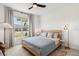Relaxing bedroom with a ceiling fan and lots of natural light at 8529 Saint Kitts Cir, Englewood, FL 34224