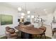 Open dining room, kitchen, and living area with modern furniture, lighting, and décor at 8529 Saint Kitts Cir, Englewood, FL 34224
