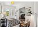 Bright foyer featuring neutral tile, modern lighting, and an entryway to a living space at 8529 Saint Kitts Cir, Englewood, FL 34224