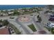 Shot shows an elevated view of a beautifully landscaped traffic circle, enhancing the community's aesthetic and accessibility at 8701 Pickwick Rd, North Port, FL 34287