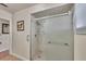 Bathroom featuring a shower with glass doors and tiled walls at 8701 Pickwick Rd, North Port, FL 34287
