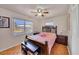 Bright bedroom with a ceiling fan and views from the window at 8701 Pickwick Rd, North Port, FL 34287