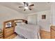 Comfortable bedroom featuring a ceiling fan, wooden floors, and matching wooden furniture at 8701 Pickwick Rd, North Port, FL 34287