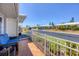 Inviting front porch featuring comfortable blue seating and beautiful landscaping at 8701 Pickwick Rd, North Port, FL 34287