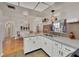 Spacious kitchen with modern cabinets, stainless appliances, and a cozy dining nook nearby at 8701 Pickwick Rd, North Port, FL 34287