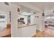 Functional kitchen with a breakfast bar, stainless steel appliances, and cozy eat-in area at 8701 Pickwick Rd, North Port, FL 34287