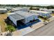Aerial view of a well-maintained home with a carport in a mobile home community at 881 Grado Dr, Venice, FL 34285