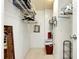 Spacious walk-in closet provides ample storage space with built-in shelving and hanging rods at 881 Grado Dr, Venice, FL 34285