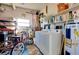 Functional laundry room with washer, dryer, and ample storage space for household needs and cleaning supplies at 881 Grado Dr, Venice, FL 34285
