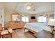 Relaxing main bedroom boasts hardwood floors, neutral walls, a ceiling fan, and plenty of closet space at 881 Grado Dr, Venice, FL 34285