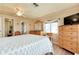 Relaxing main bedroom features an ensuite bathroom, hardwood floors, and neutral walls at 881 Grado Dr, Venice, FL 34285