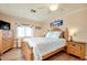 Comfortable main bedroom boasts hardwood floors, neutral walls, plenty of light, and ample closet space at 881 Grado Dr, Venice, FL 34285