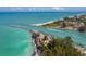 Panoramic aerial view of a gorgeous coastal inlet with crystal-clear water and scenic beaches at 929 Cypress Ave, Venice, FL 34285